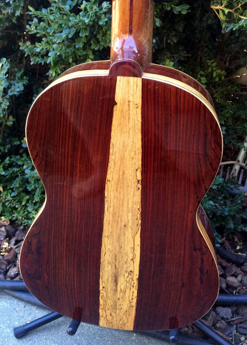 All hand made solid wood guitar back.
